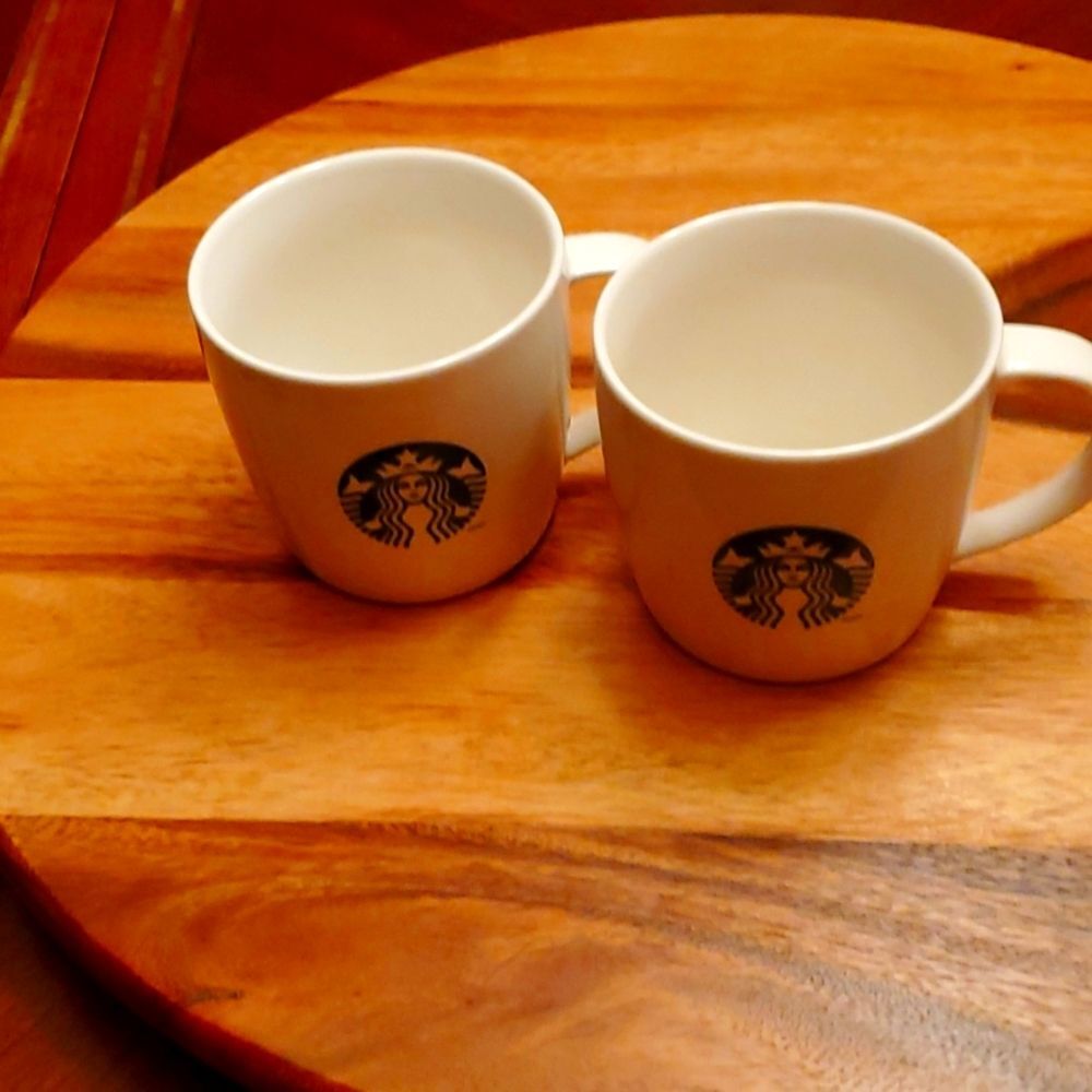 Two Staturbucks Coffee cups